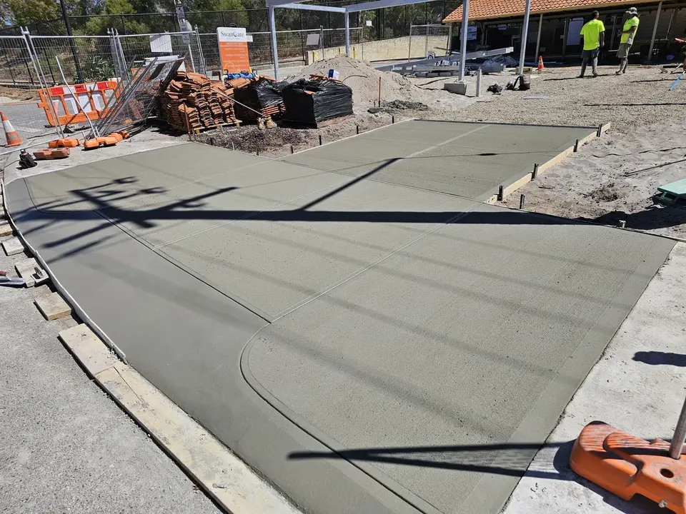 Freshly poured concrete slab with formwork on a Perth residential building site