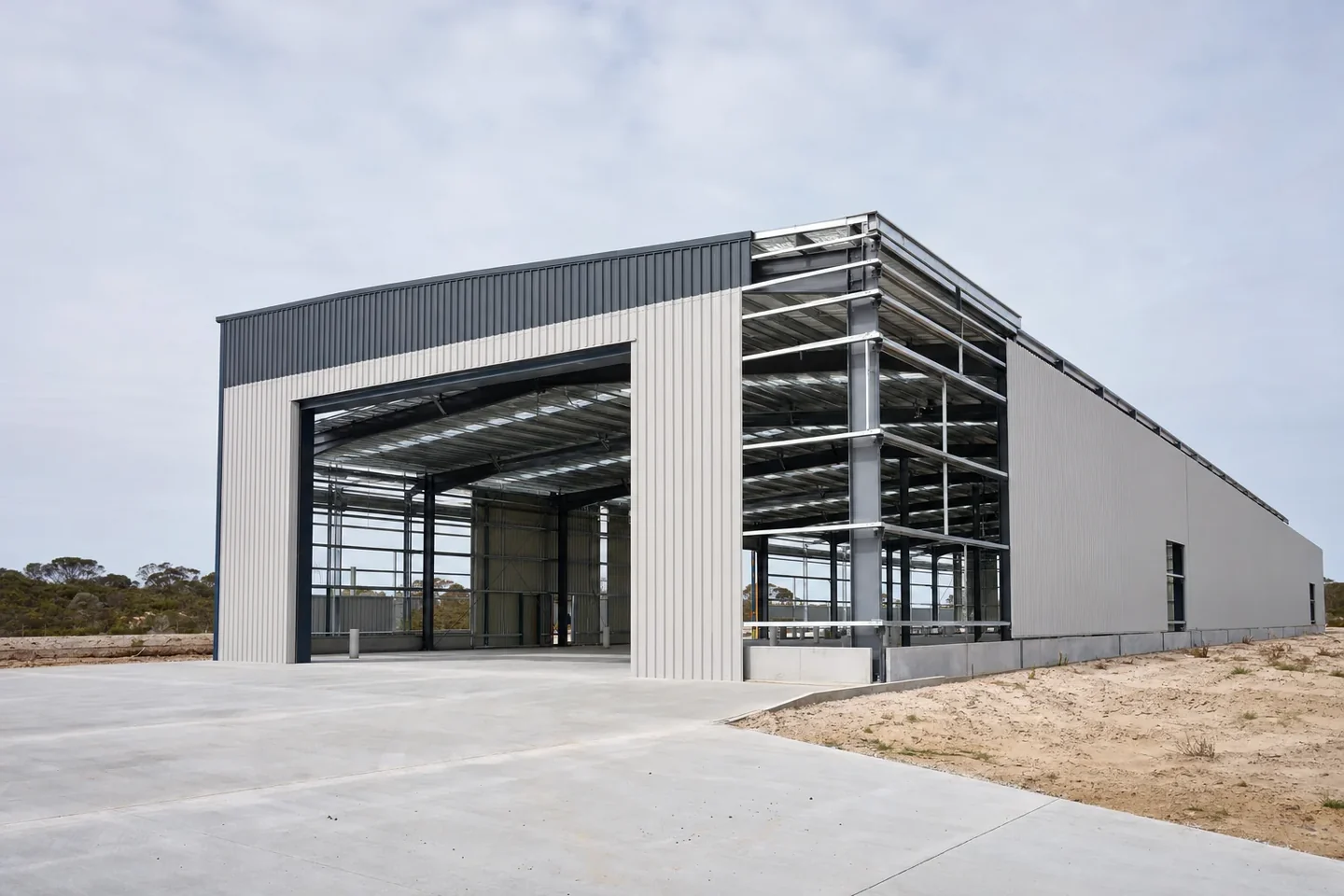 Large industrial warehouse under construction on the outskirts of Perth with the steel portal frame partly clad